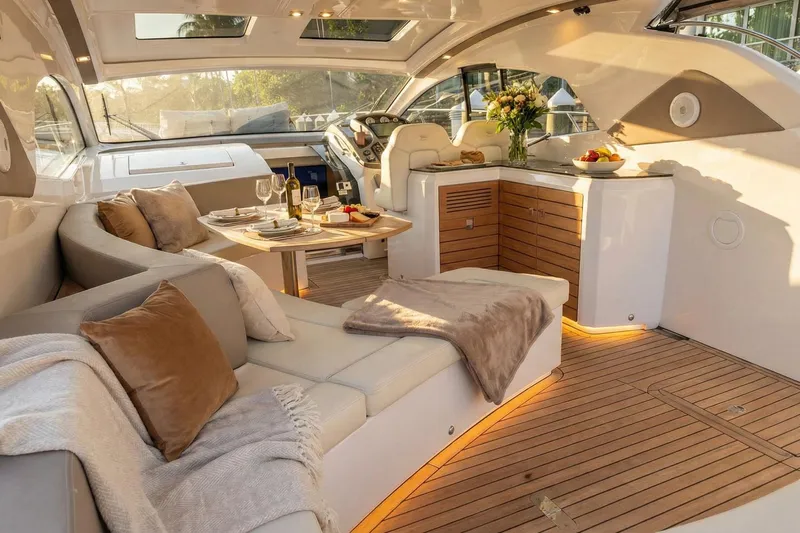  Yacht Photos Pics Luxurious interior of 2024 Sessa Marine C44 Cruiser with elegant seating and dining area.