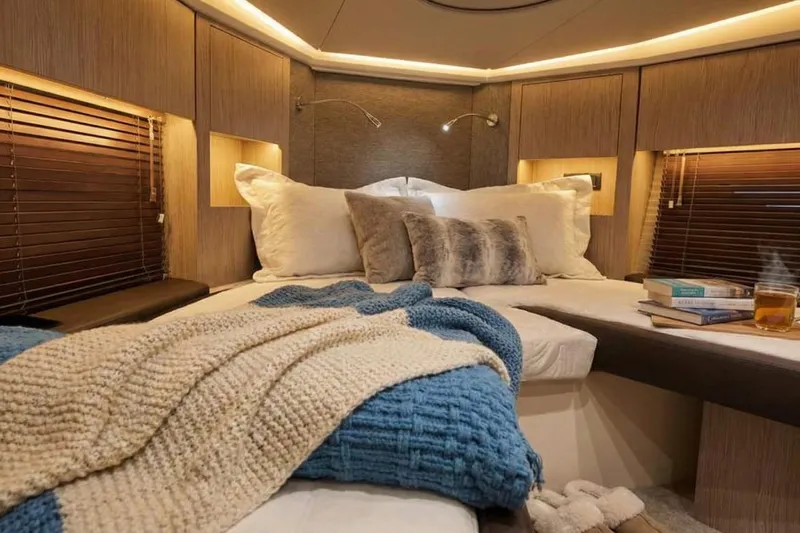  Yacht Photos Pics Luxurious 2024 Sessa Marine C44 Cruiser cabin with cozy bedding and ambient lighting.