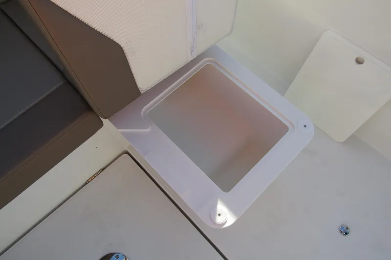  Yacht Photos Pics Storage compartment on 2025 Nimbus Tender 9 boat, featuring sleek design and practical seating.