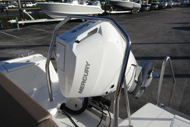  Yacht Photos Pics 2025 Nimbus Tender 9 with Mercury outboard engine in a boatyard setting.