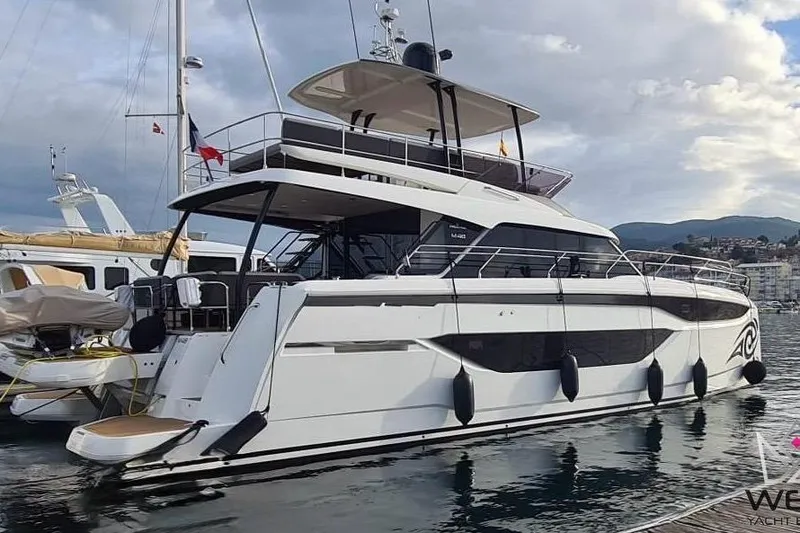 Moana Yacht Photos Pics Luxury 2024 Prestige M48 yacht docked at marina, showcasing sleek design and modern features.