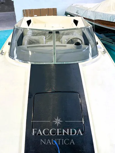  Yacht Photos Pics 1981 Riva SAINT TROPEZ boat with sleek design, windshield, and Faccenda Nautica branding.