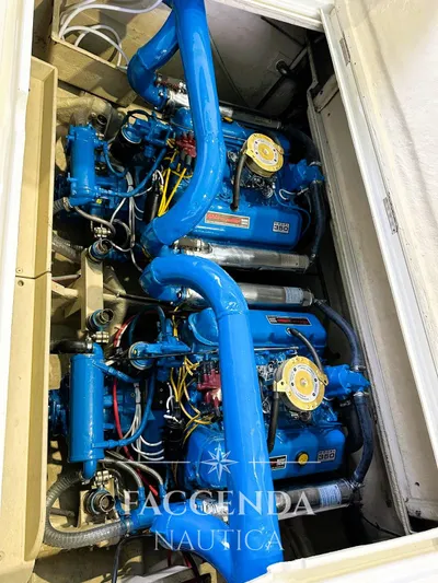  Yacht Photos Pics Engine compartment of a 1981 Riva SAINT TROPEZ boat with blue components.