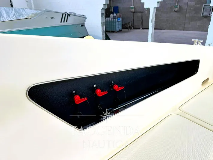  Yacht Photos Pics 1981 Riva SAINT TROPEZ boat interior with red switches and black panel.