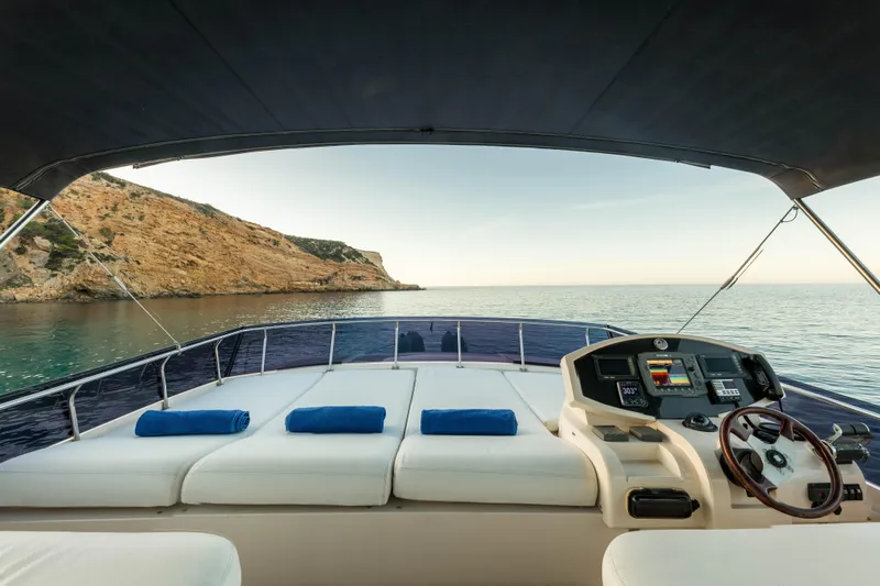 Mr Corn Yacht Photos Pics Luxurious Rodman Muse 74 yacht interior, 2010 model, with scenic ocean view and plush seating.