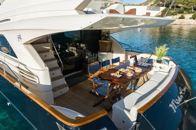 Mr Corn Yacht Photos Pics Luxurious 2010 Rodman Muse 74 yacht with elegant outdoor dining setup.