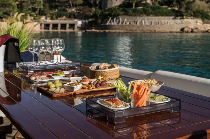 Mr Corn Yacht Photos Pics Luxurious yacht dining setup with appetizers and wine on a Rodman Muse 74, 2010.