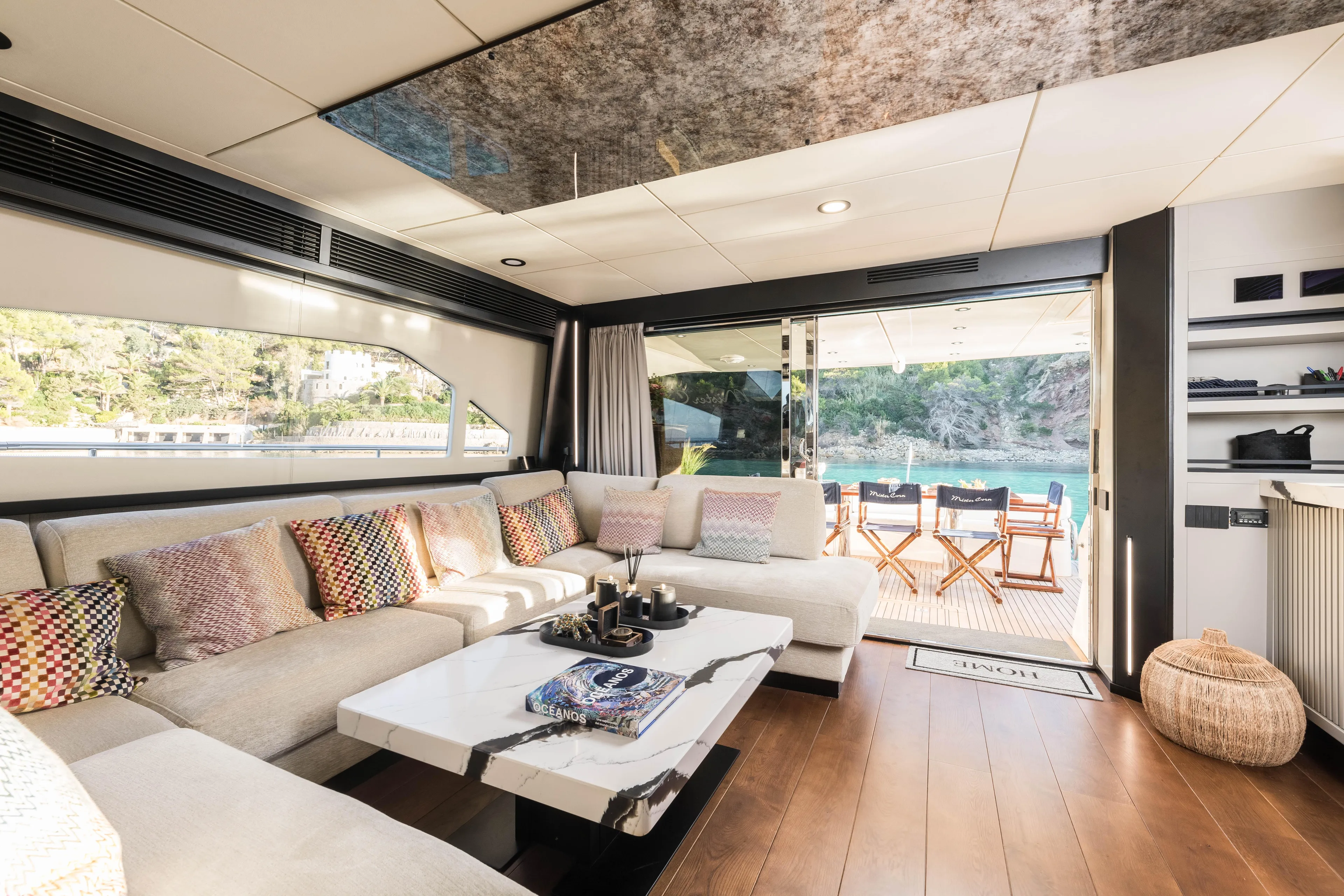 Mr Corn Yacht Photos Pics Luxurious interior of 2010 Rodman Muse 74 yacht with elegant seating and scenic view.