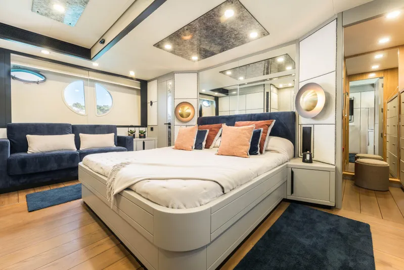 Mr Corn Yacht Photos Pics Luxurious bedroom interior on 2010 Rodman Muse 74 yacht, featuring modern design and elegant decor.