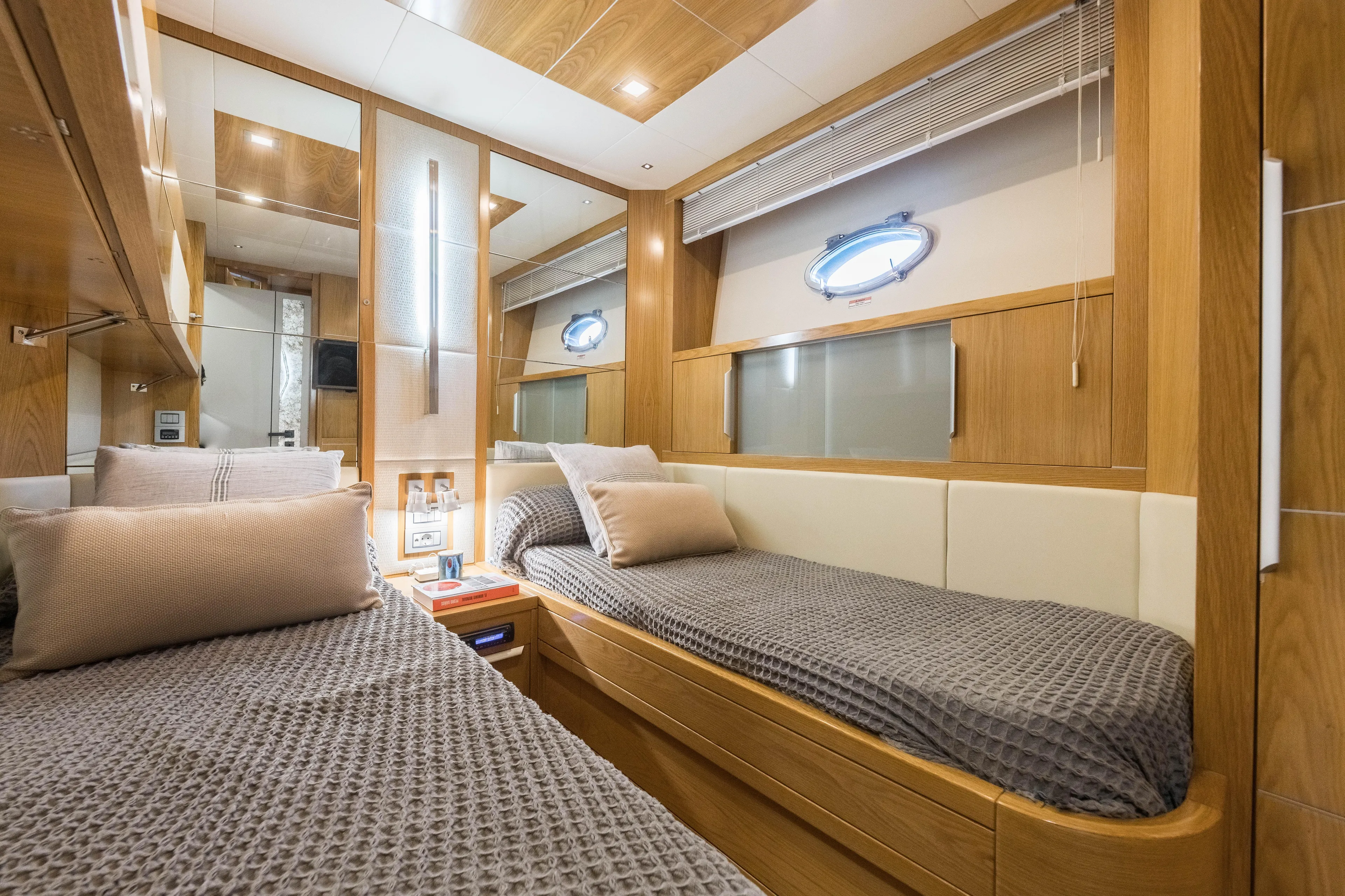 Mr Corn Yacht Photos Pics Luxurious cabin interior of 2010 Rodman Muse 74 yacht with twin beds and wooden finish.