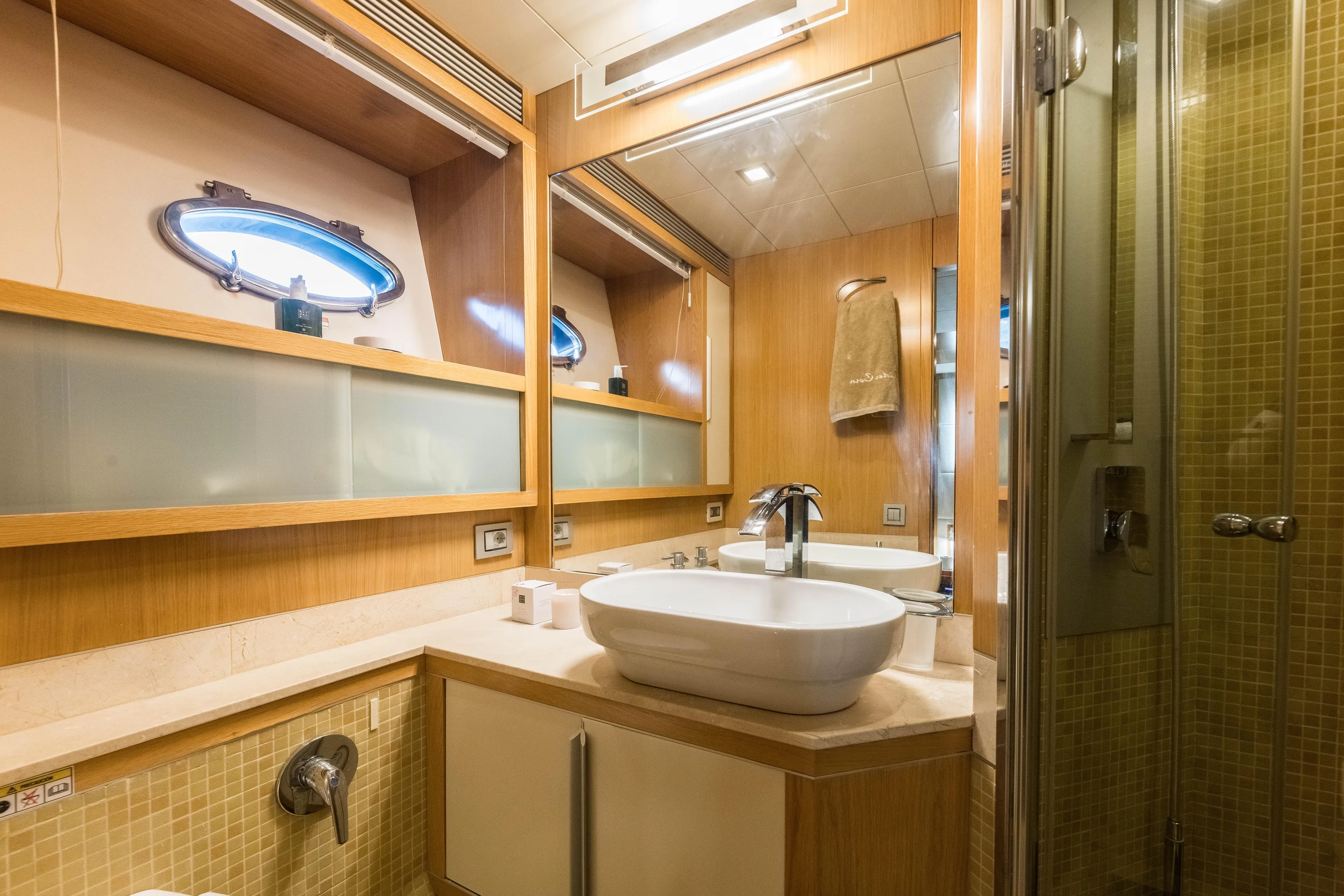 Mr Corn Yacht Photos Pics Luxurious bathroom interior of 2010 Rodman Muse 74 yacht with modern fixtures.