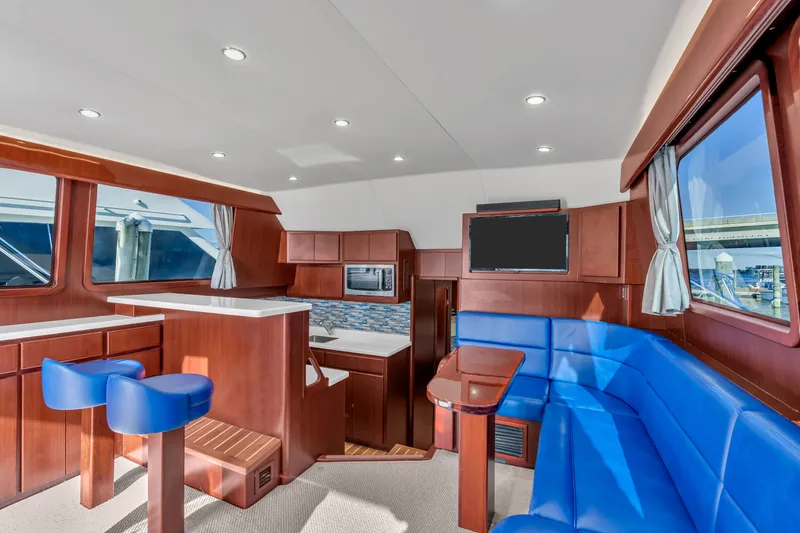 Sligo Yacht Photos Pics Luxurious interior of 2023 Henriques 42 Convertible yacht with modern seating and kitchen area.