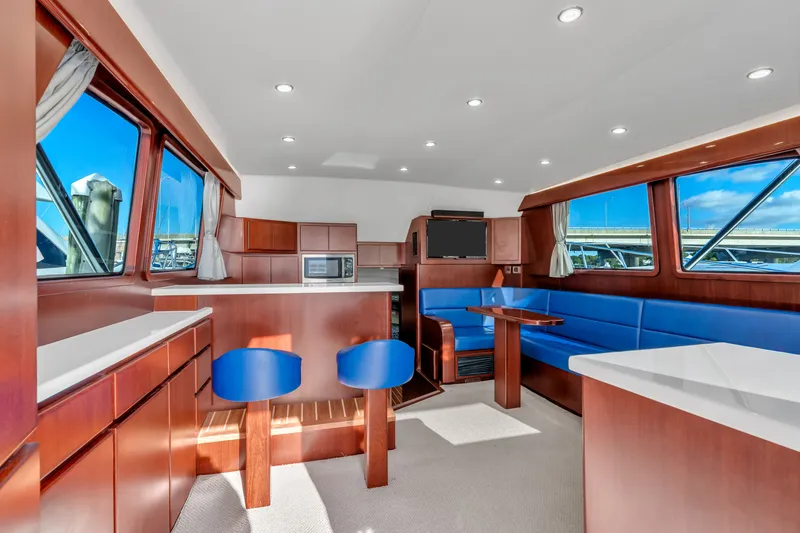 Sligo Yacht Photos Pics Luxurious interior of 2023 Henriques 42 Convertible yacht with modern seating and kitchen area.