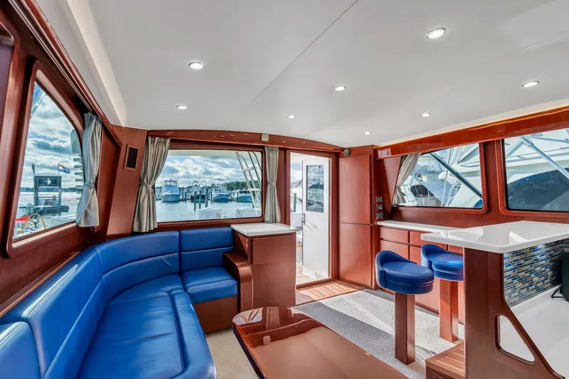 Sligo Yacht Photos Pics Luxurious interior of 2023 Henriques 42 Convertible yacht with blue seating and modern design.