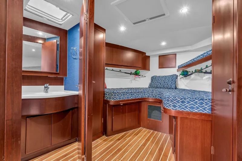 Sligo Yacht Photos Pics Luxurious cabin interior of 2023 Henriques 42 Convertible yacht with wood finishes.