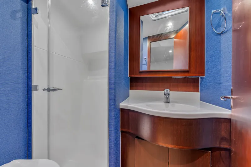 Sligo Yacht Photos Pics Luxurious bathroom in 2023 Henriques 42 Convertible yacht with modern fixtures and elegant wood accents.