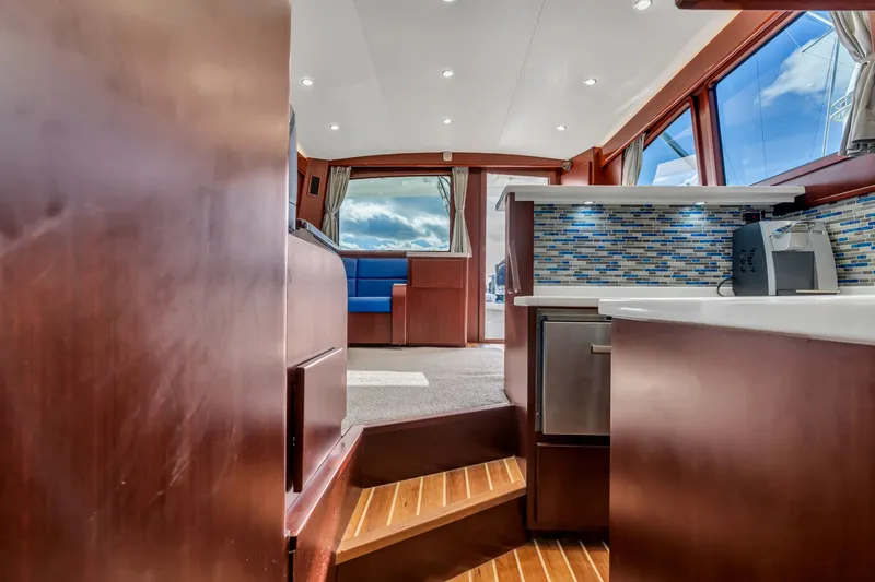 Sligo Yacht Photos Pics Interior of 2023 Henriques 42 Convertible yacht with modern kitchen and seating area.