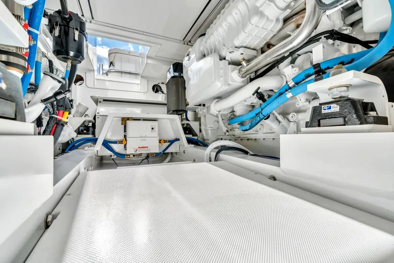 Sligo Yacht Photos Pics Engine room of 2023 Henriques 42 Convertible yacht, showcasing modern machinery and blue piping.