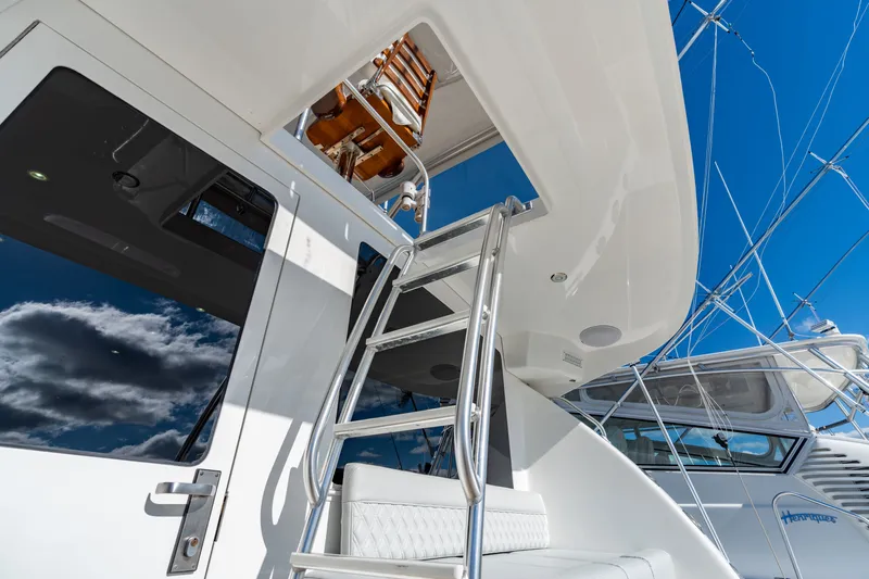 Sligo Yacht Photos Pics 2023 Henriques 42 Convertible yacht with ladder and sleek design under blue sky.