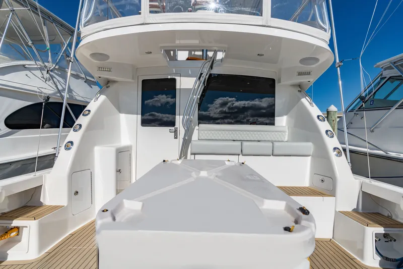 Sligo Yacht Photos Pics 2023 Henriques 42 Convertible yacht deck with seating, sleek design, and clear blue sky.