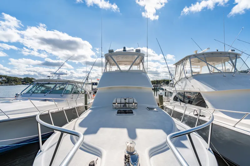 Sligo Yacht Photos Pics 2023 Henriques 42 Convertible yacht docked under a bright blue sky.