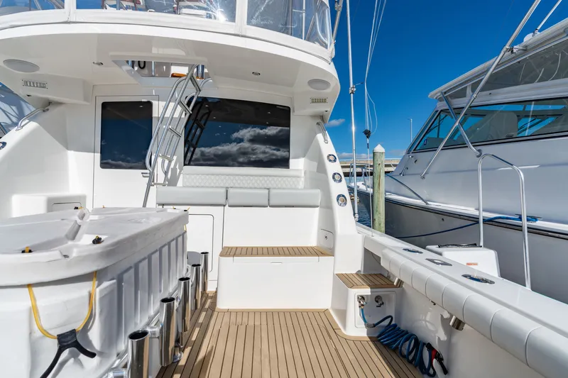 Sligo Yacht Photos Pics 2023 Henriques 42 Convertible yacht deck with seating and fishing equipment.