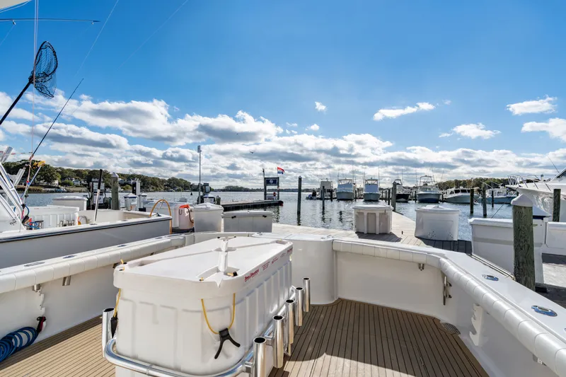 Sligo Yacht Photos Pics 2023 Henriques 42 Convertible yacht docked at a marina under a clear blue sky.
