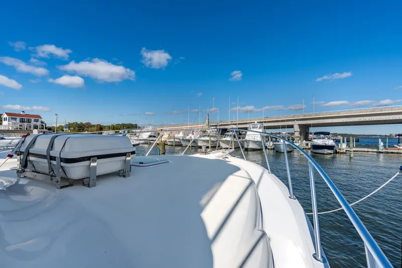 Sligo Yacht Photos Pics 2023 Henriques 42 Convertible yacht docked at marina under clear blue sky.