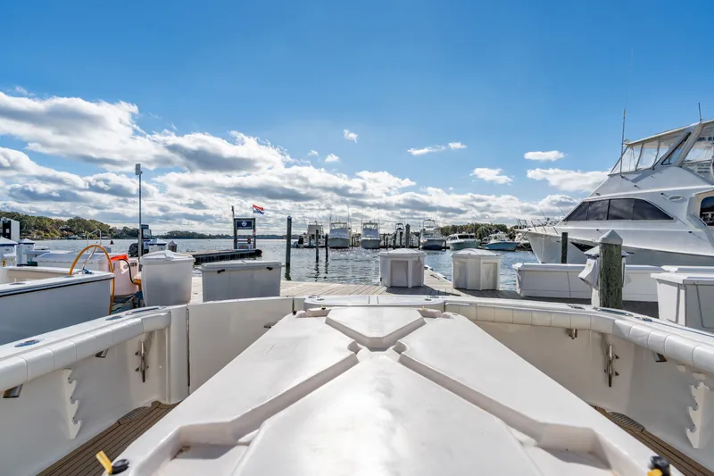 Sligo Yacht Photos Pics 2023 Henriques 42 Convertible yacht docked at a marina under a clear blue sky.