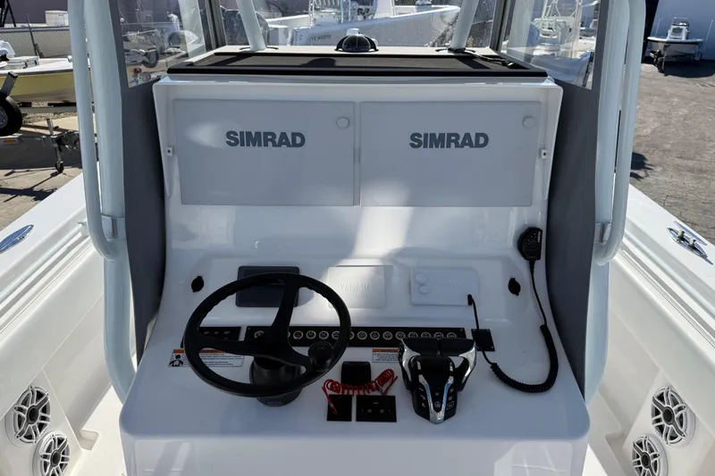  Yacht Photos Pics 2024 Contender 30 ST boat console with Simrad electronics and steering wheel.