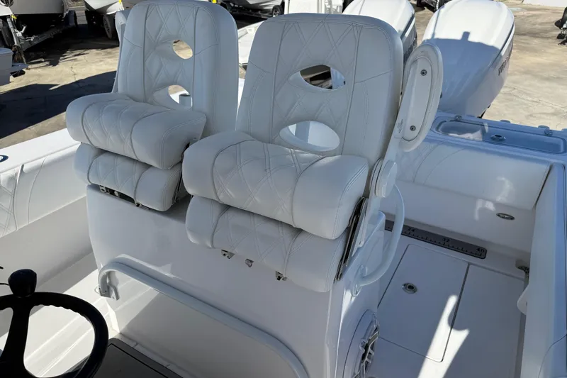  Yacht Photos Pics 2024 Contender 30 ST boat with luxurious white seating and modern design.