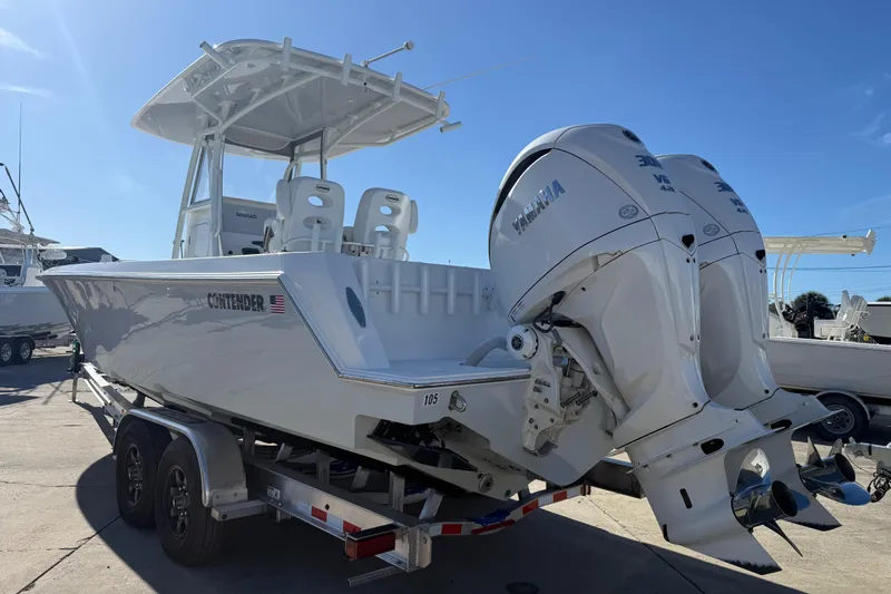  Yacht Photos Pics 2024 Contender 30 ST boat with dual Yamaha engines on trailer, sunny day.