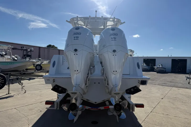  Yacht Photos Pics 2024 Contender 30 ST boat with dual 300 V6 engines, docked outdoors.