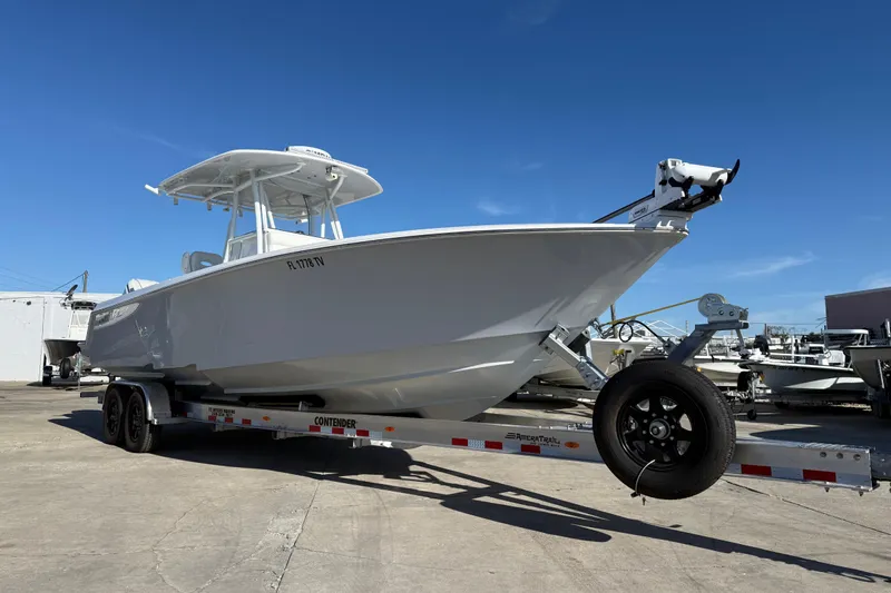  Yacht Photos Pics 2024 Contender 30 ST boat on trailer under clear blue sky.