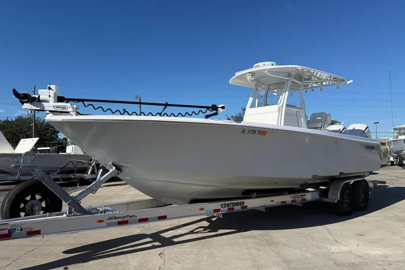  Yacht Photos Pics 2024 Contender 30 ST boat on trailer under clear blue sky.