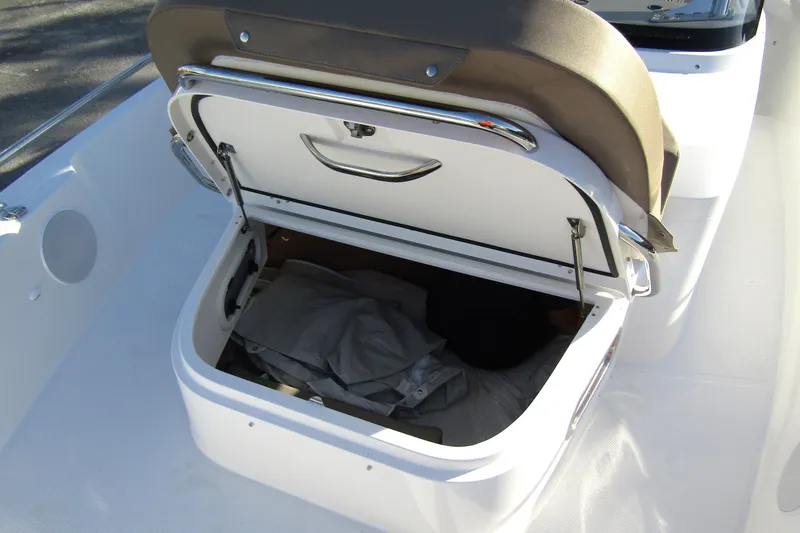  Yacht Photos Pics Open storage compartment on 2025 Nimbus Tender 9 boat, showcasing interior space.