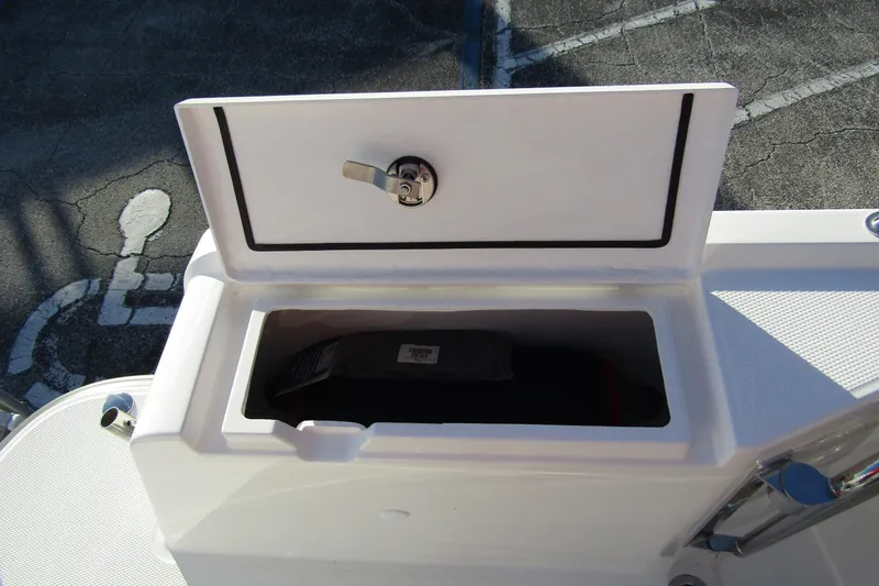  Yacht Photos Pics Open storage compartment on 2025 Nimbus Tender 9 boat, featuring secure latch.