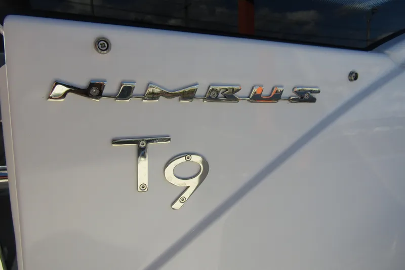  Yacht Photos Pics Close-up of 2025 Nimbus Tender 9 logo on white surface.