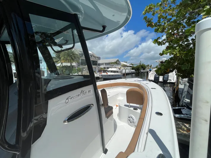 2020 Sea Hunt 30 Gamefish Yacht Photos Pics 2020 Sea Hunt 30 Gamefish boat docked under a clear blue sky.