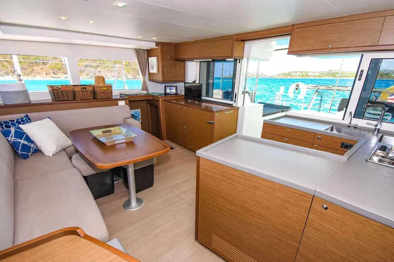Rapscallion Yacht Photos Pics Interior of 2018 Lagoon 450 F catamaran with modern kitchen and cozy seating area.