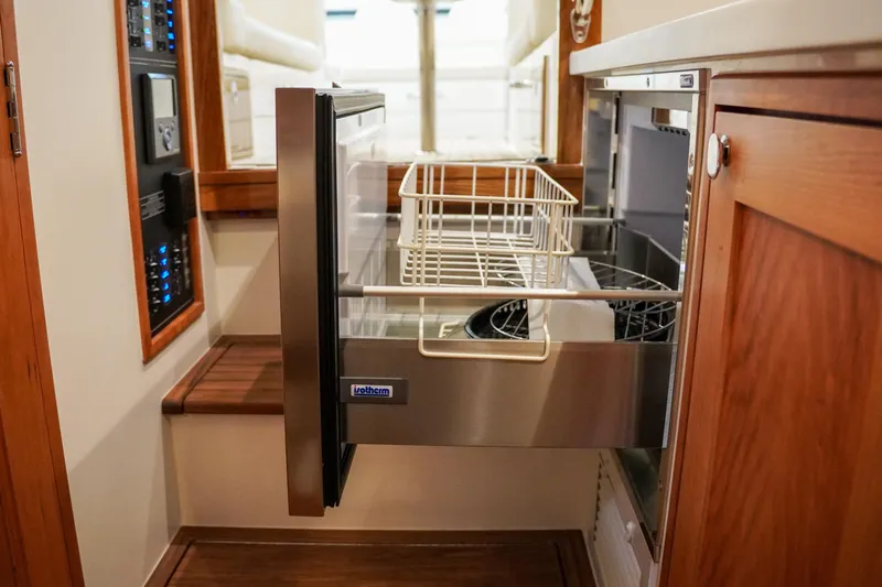 In Stock Yacht Photos Pics Modern kitchen drawer in 2025 MJM 35 boat, featuring sleek design and wood accents.