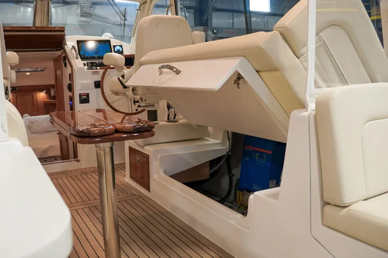 In Stock Yacht Photos Pics Interior of 2025 MJM 35 boat with helm station and luxurious seating.