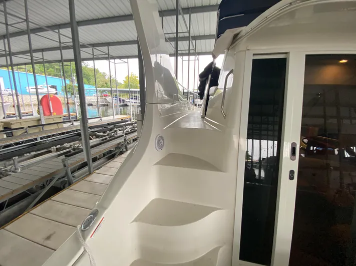  Yacht Photos Pics 2006 Carver 36 Mariner yacht docked in covered marina.