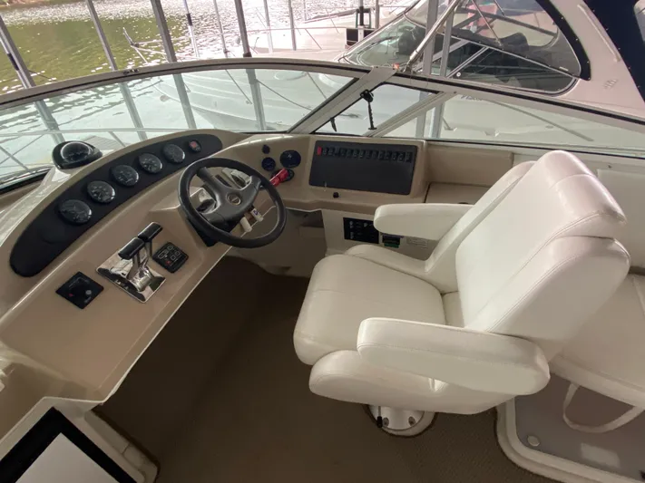  Yacht Photos Pics 2006 Carver 36 Mariner helm with steering wheel and control panel.