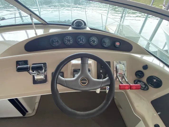  Yacht Photos Pics 2006 Carver 36 Mariner helm with steering wheel and control panel.