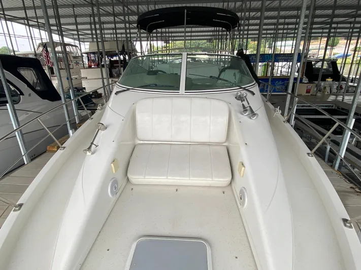  Yacht Photos Pics 2006 Carver 36 Mariner boat with spacious seating in a covered marina.