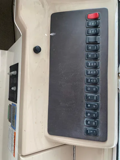  Yacht Photos Pics Control panel of a 2006 Carver 36 Mariner boat with multiple switches.