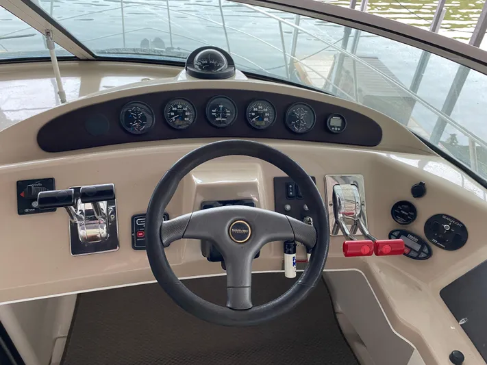  Yacht Photos Pics 2006 Carver 36 Mariner helm with steering wheel and control panel.