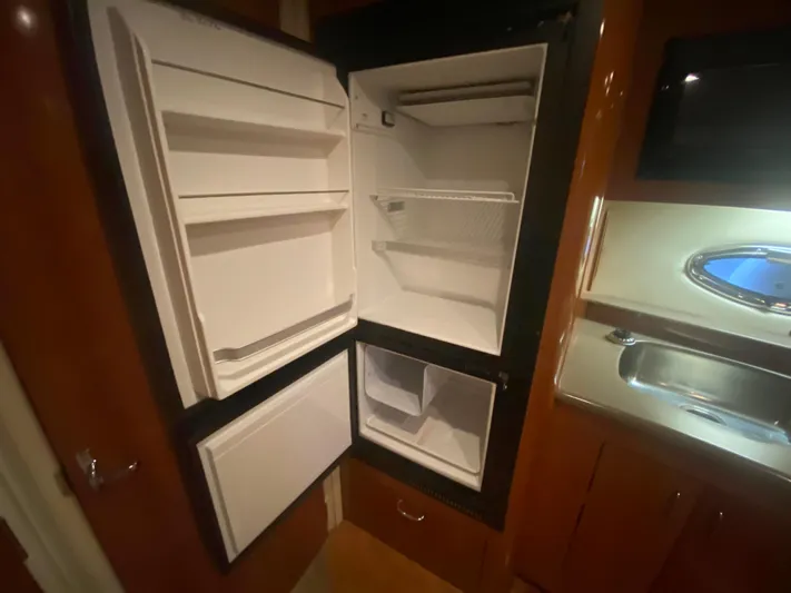  Yacht Photos Pics Open refrigerator inside 2006 Carver 36 Mariner yacht kitchen area.