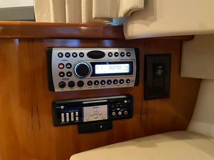  Yacht Photos Pics Carver 36 Mariner 2006 audio system and control panel on wooden interior.